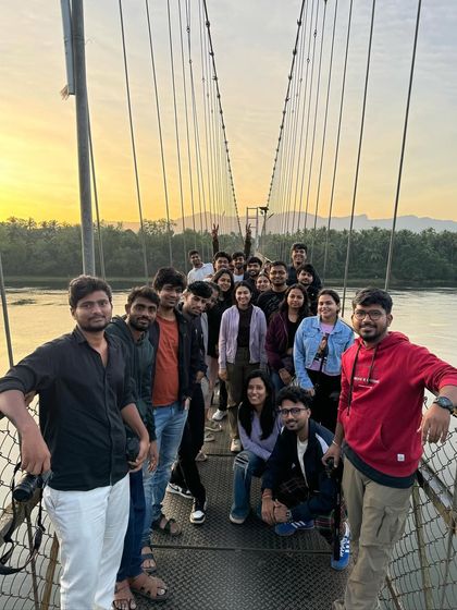 A beautiful sunset shot of our group on the suspension bridge in Honnavar during the New Year's trip.