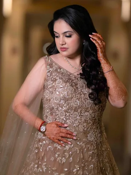 A candid moment of the bride-to-be. Her makeup is designed to be both beautiful and comfortable, allowing her to enjoy her special day.