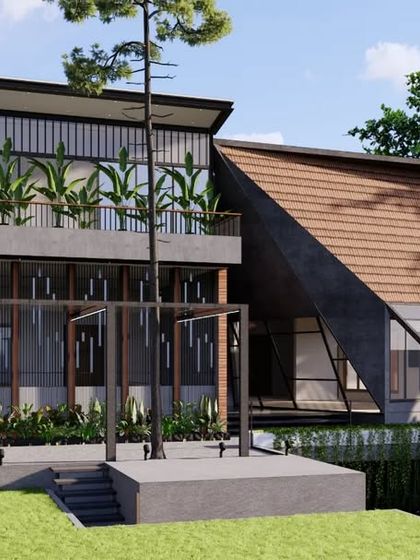 This luxury home in Mangaluru features a dramatic angled roof clad in wood, designed to handle the heavy rainfall of the coastal region. The large glass facade is protected by deep overhangs, allowing for expansive views while maintaining thermal comfort.