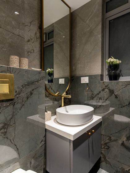 Not your typical kids’ bathroom, this one’s all grown up in style. Designed in soft tints of grey with a marble glossy finish, this half-and-half bathroom balances aesthetics with safety, featuring a level difference on the wall and waterproof PVC lighting.