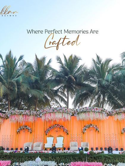 A vibrant and detailed reception stage with peach drapes and floral arches, set against a backdrop of palm trees. This is where perfect memories are crafted.