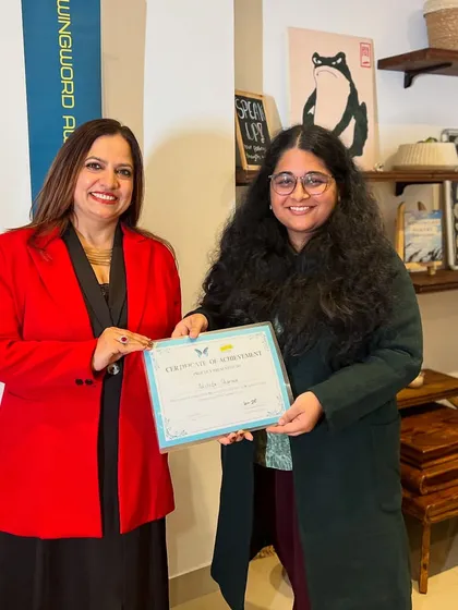 Our winners are celebrated at a live award ceremony in Delhi. Here, a top poet receives her certificate of achievement, a moment of recognition in front of a community that understands and values her work.