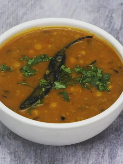 A simple, wholesome, and flavourful Yellow Dal Tadka. It's tempered with spices and garnished with fresh coriander, making it the ultimate comfort food.