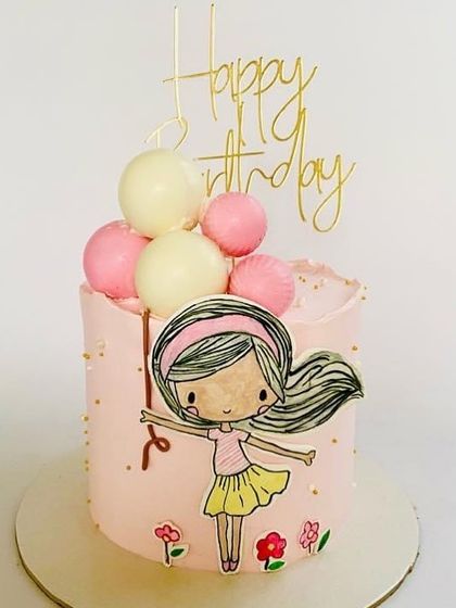 A cute cake featuring a girl holding balloons, perfect for a simple birthday.