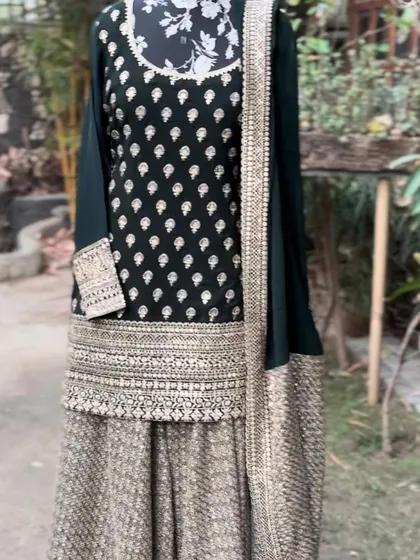 The full view of the forest green sharara set. A perfect outfit for a winter wedding.