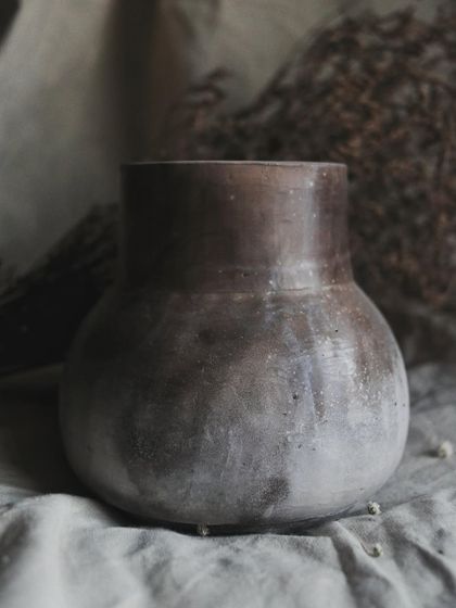 Another view of the 'Stardust' vase, showing how the smoky markings wrap around the form. This piece is perfect for holding dried flowers.