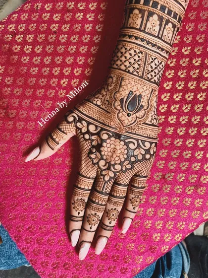 A beautiful hand design with a mix of floral, paisley, and geometric patterns.