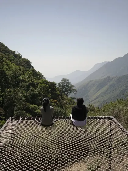 Relaxing on the net bed overlooking the mountains.