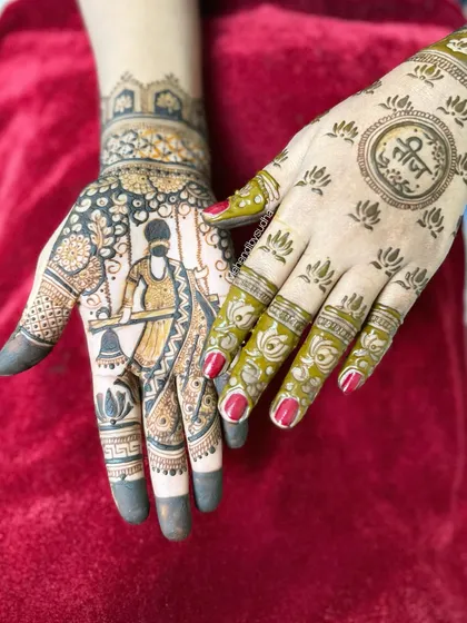 A unique shot showing the contrast between the intricate, dark henna paste on one hand and the simple, elegant design on the other, which says "Teej" in Hindi.
