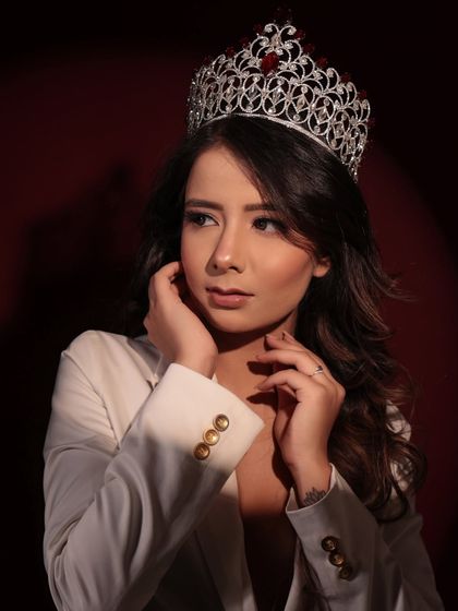 A regal and powerful look for this beauty queen. The makeup is glamorous and polished, fit for royalty.