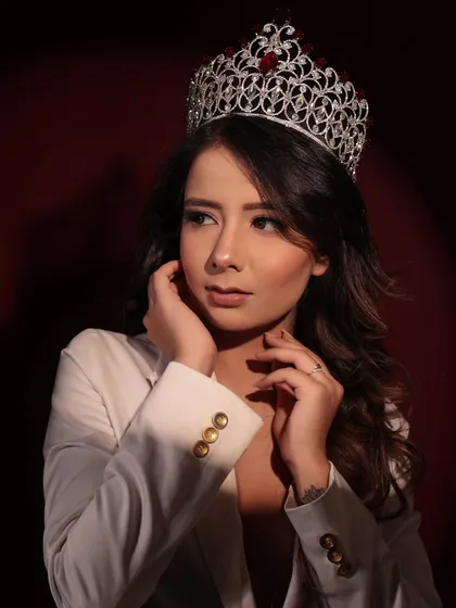 A regal and powerful look for this beauty queen. The makeup is glamorous and polished, fit for royalty.
