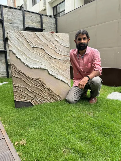 For modern homes, I create textured abstract paintings like this one. Using a palette knife, I build layers to give the canvas a unique 3D feel that plays with light and shadow, adding a contemporary touch to any wall.