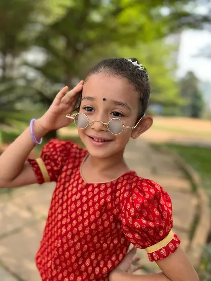 A smile that can light up the stage. This close-up shows the joy and confidence we nurture in our youngest dancers.