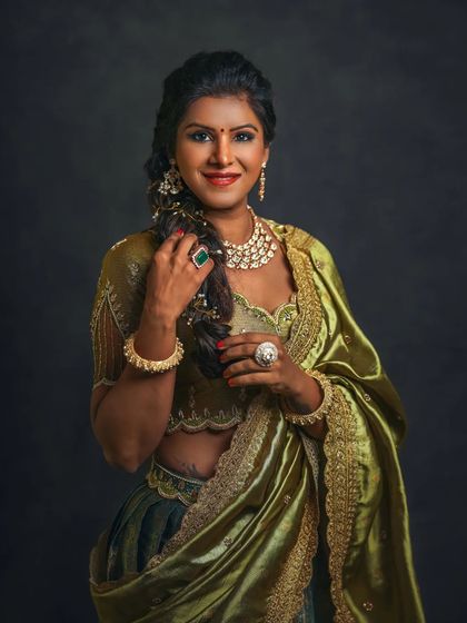 A portrait from my Women's Day series, celebrating the elegance and strength of women. The rich green saree and traditional jewelry create a regal look, captured with classic, painterly lighting.