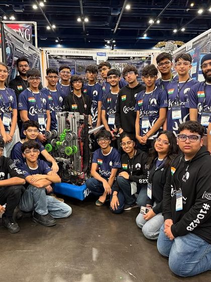 Team Kaizen, a rookie team with incredible talent, gathers for a group photo in the pits at the FIRST World Championship.