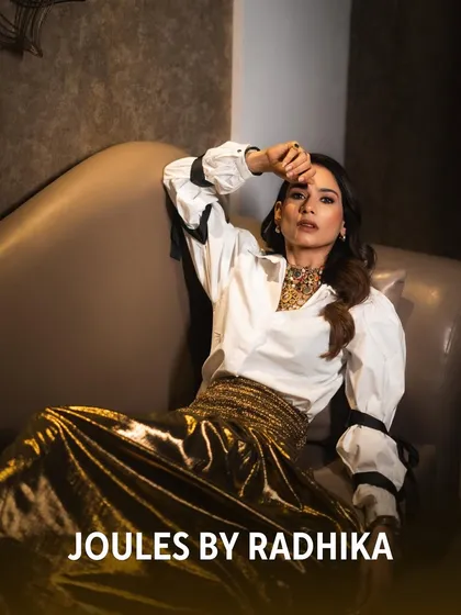 Aneri Vajani exudes high-fashion energy, lounging gracefully while our statement necklace adds a powerful dose of color and luxury.