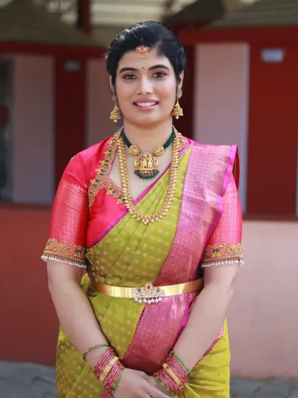 A full portrait of the client, looking radiant for her son's naming ceremony. The makeup is designed to photograph beautifully and highlight her features.