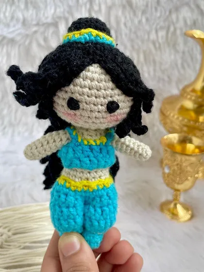 Princess Jasmine from Aladdin. I loved creating her iconic blue outfit and hairstyle. She is ready for a magic carpet ride and makes a wonderful addition to the Disney princess collection.