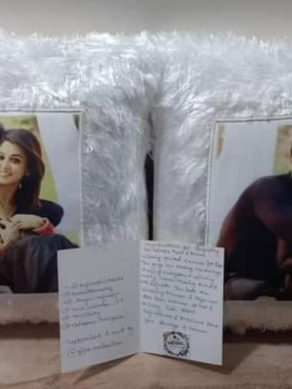 The custom pillows for Ankur Verma and Tanvi Dogra, shown with the heartfelt handwritten card from their fans.
