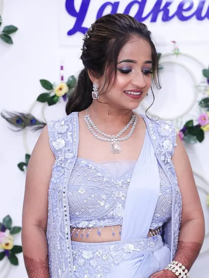 A close-up of her makeup and outfit.