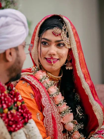 A candid glance between the bride and groom during their Nikah ceremony. I focus on capturing these unscripted, heartfelt interactions that tell the true story of your day.