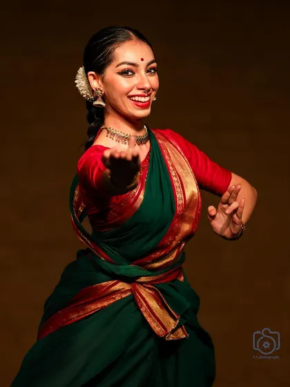 A dynamic action shot from the 'Navarasotsava' performance, showing the energy and rhythm of the dance.
