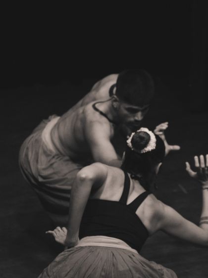 An intimate, black and white shot capturing the connection between two performers during our Kalaripayattu production.