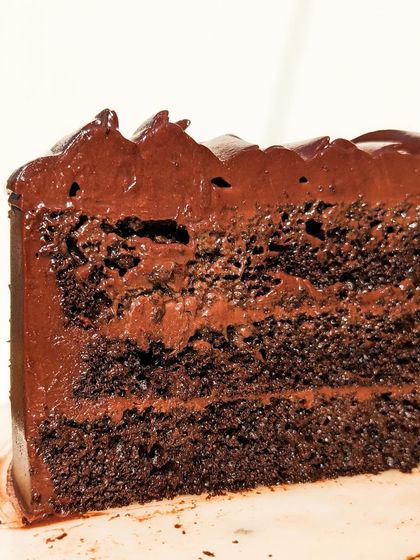 A cross-section of our Belgian Dark Chocolate cake. You can see the perfect ratio of moist sponge to rich, velvety ganache in every layer.