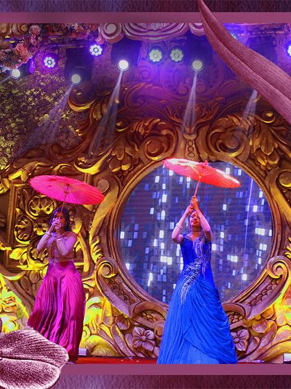 Using props can add a beautiful, traditional touch to any performance. Here, dancers use classic umbrellas as part of a gracefully choreographed routine on a lavishly decorated stage.