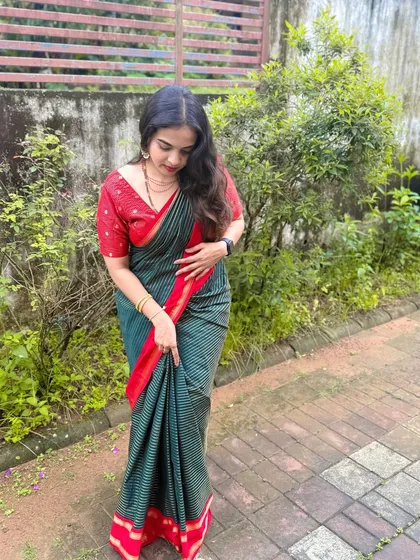 A full-length view of this understated and elegant look. The hair is styled in simple, loose waves, and the makeup is fresh and light, perfect for a daytime family gathering.