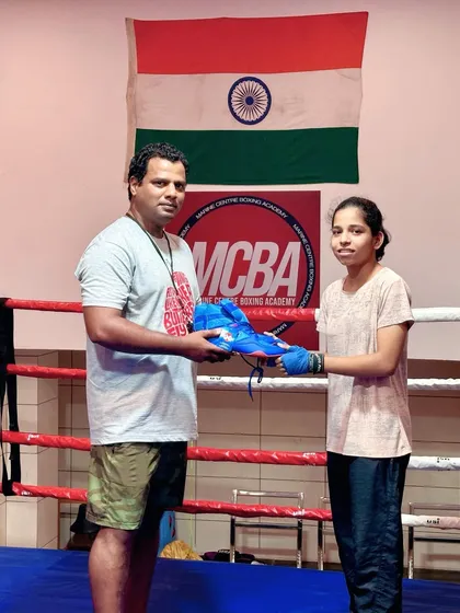 Another one of our dedicated female boxers receiving her reward for excellent performance.