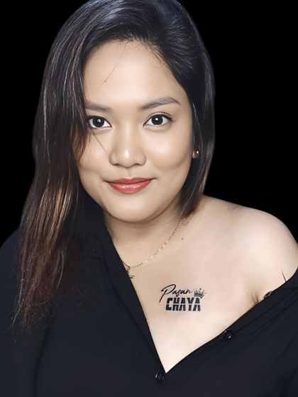 A "Pyaar" and "Chhaya" name tattoo on the collarbone, designed with a crown.