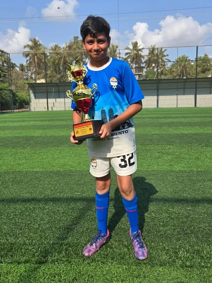 This U14 player celebrates his team's victory in Goa.