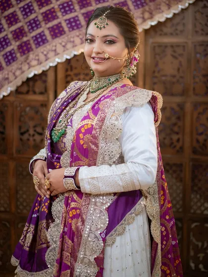 A smiling bride, embodying the joy and beauty of a traditional Gujarati wedding.