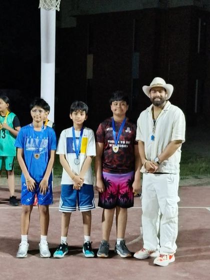 A boys' team proudly displays their medals after competing in the 3x3 tournament. These events build camaraderie and a love for the game.