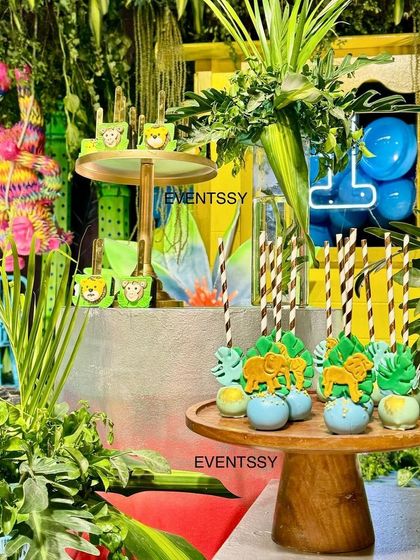 Themed cake pops and desserts that perfectly match the neon jungle color scheme.