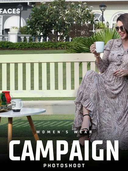 This outdoor shot features a model in a flowing printed maxi dress, enjoying a moment of relaxation. It's a perfect lifestyle image for a resort or summer wear collection.
