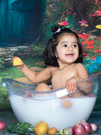 A unique twist on the bath shoot, with this little one surrounded by fresh vegetables.