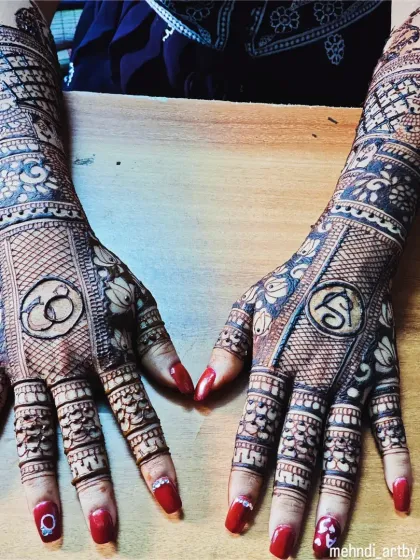 For engagement ceremonies, I can weave your story into the henna. This design features the couple's initial 'S' and a symbol of their union with interlocking rings, making it a truly personal piece of art.