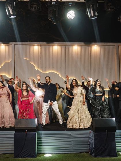 The entire family on stage for the final bow. A perfect end to a night of spectacular sangeet performances.