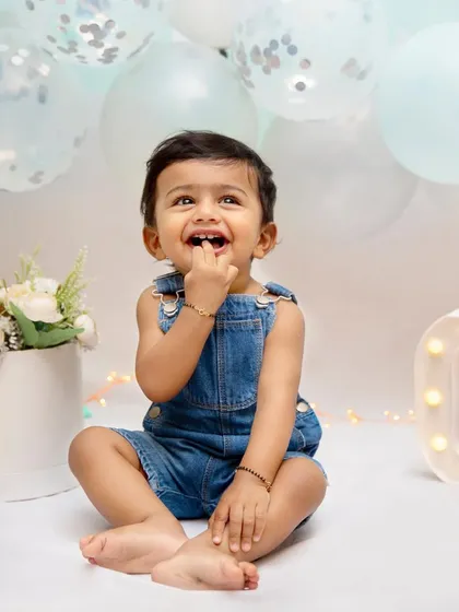 The magic of childhood, captured forever. This little one's curious and happy expression during his first birthday shoot is a perfect example of the elegant and graceful moments I strive to capture.