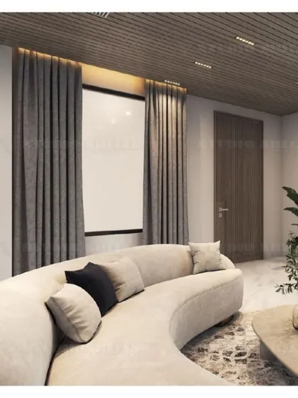 A curved, light-colored sofa provides a soft contrast to the dark wood-paneled ceiling and heavy drapes in this Mansarovar Garden lobby.
