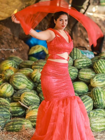 A creative and vibrant summer-themed shoot with an actress in a red outfit surrounded by watermelons. This series is playful and colorful, perfect for a brand campaign or a unique portfolio piece.