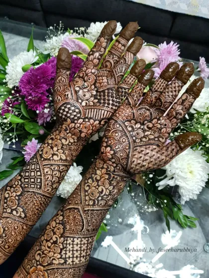 A close-up shot that captures the fine details and textures within this Indian floral henna.