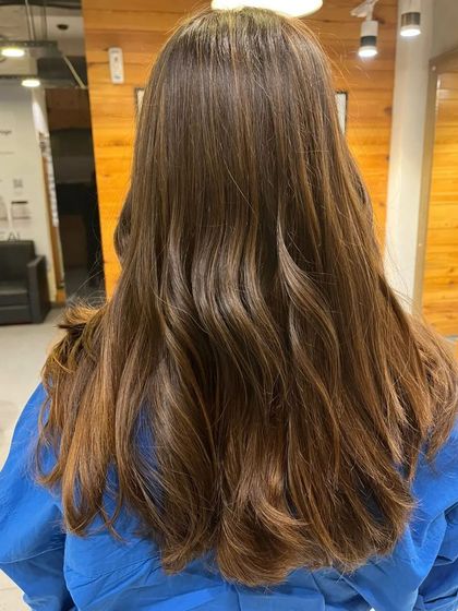 A subtle and soft brownish balayage. This is a great option if you want a low-maintenance color that enhances your natural base.