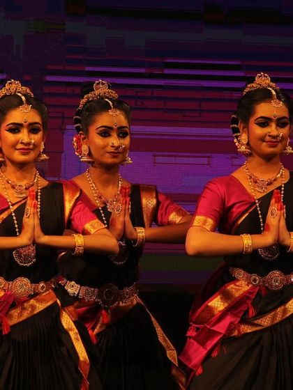 A trio of my senior dancers in a pose of reverence, their expressions and postures conveying deep devotion during the 'Ayyappa Kavuthuvam'.
