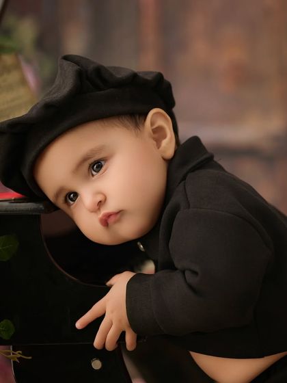 A pensive moment from our little pianist. We capture a full range of expressions, from joyful laughter to quiet contemplation.