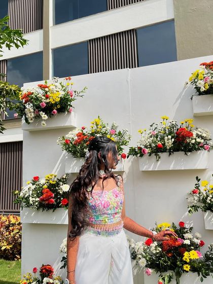 Surrounded by flowers that inspired my work. Wearing my own hand-painted creation in a setting that feels just as vibrant and full of life is a wonderful feeling.