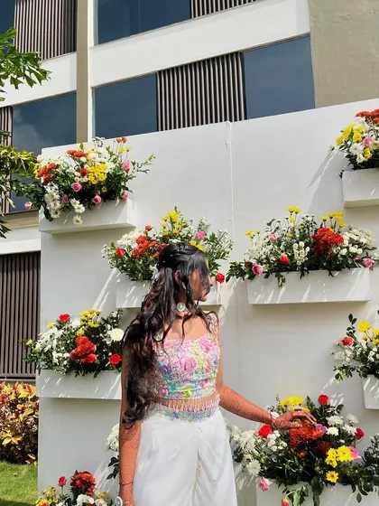 Surrounded by flowers that inspired my work. Wearing my own hand-painted creation in a setting that feels just as vibrant and full of life is a wonderful feeling.
