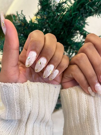 A close-up of the delicate gold foil flakes embedded in the polish.